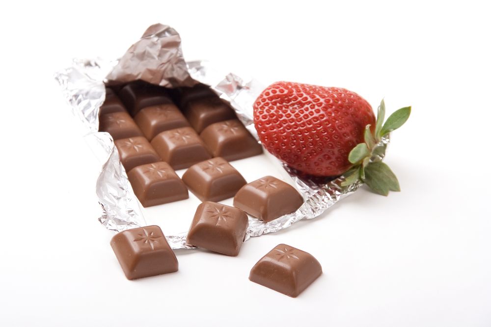 chocolate bar with a fresh red strawberry