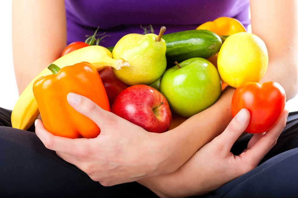 Healthy eating, happy woman with fruits and vegetables, closed-up