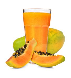 Glass of papaya smoothie isolated on white