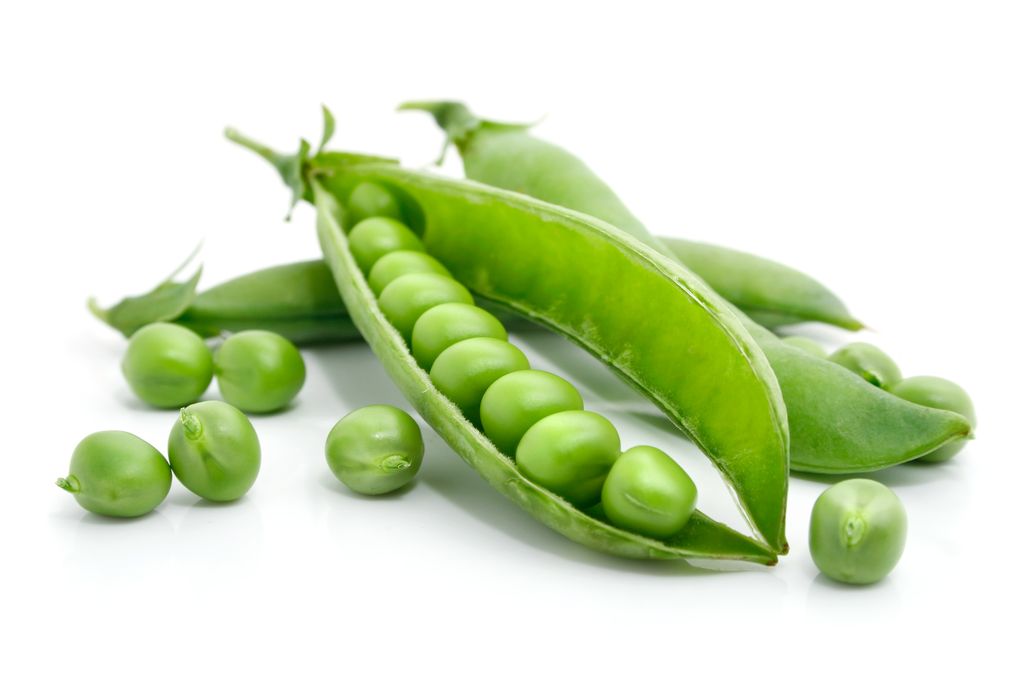 fresh green pea in the pod isolated on white background